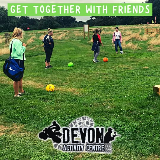 Friends making their way around the football golf course
